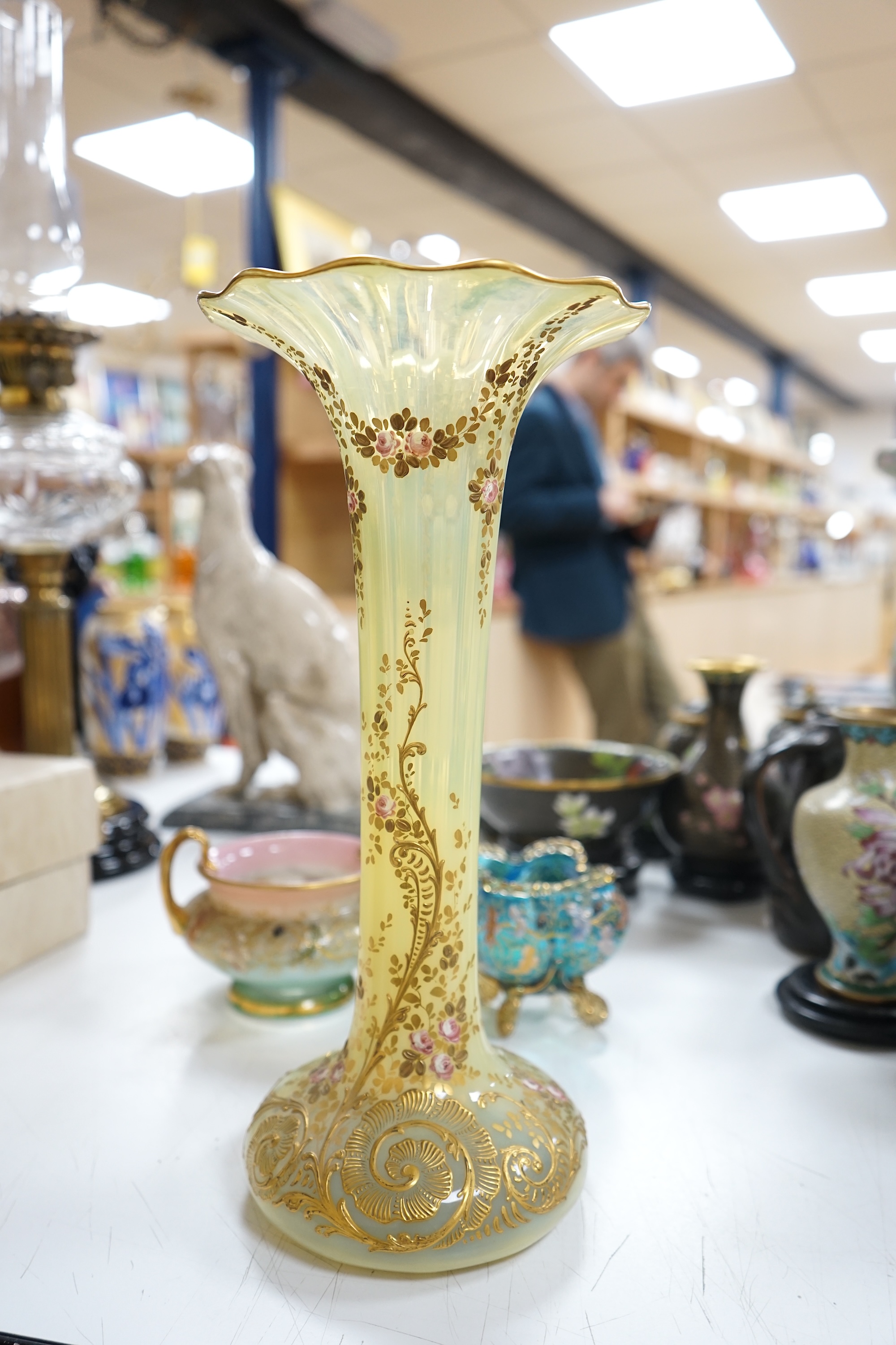 Three Bohemian gilt decorated glass vessels, including two Moser bowls and a tall Vaseline vase, 34.5cm high. Condition - good.